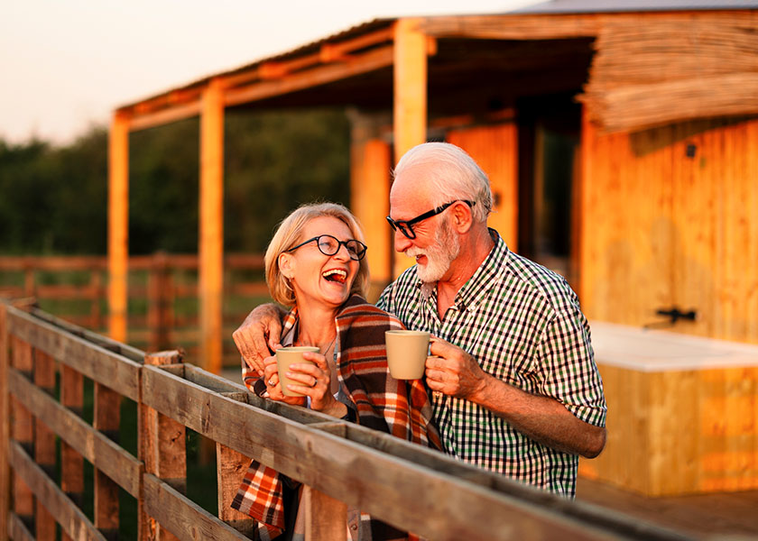 Retired couple enjoying coffee together.