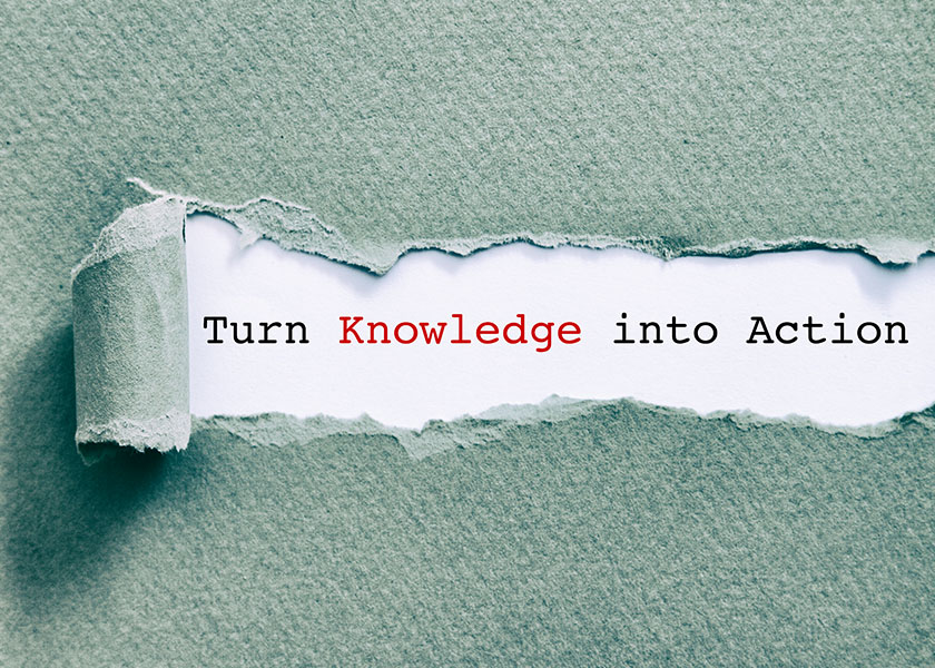 Aqua-colored textured paper, a portion torn back to reveal the words “Turn Knowledge into Action.” | A Beginner’s Guide to Market Investment Terms